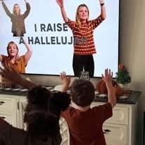 Children worshipping together at Christian Roots Academy